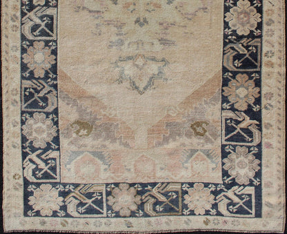 Vintage Turkish Oushak Rug in Tan & Navy Blue. Vintage Oushak Rug in Tan & Navy Blue With Floral Medallion Design and Sub Geometric Border in boteh and botanical motifs. Keivan Woven Arts/ rug EN - 179353, country of origin / type: Turkey / Ousha... - Keivan Woven ArtsEN - 179353 - 12357Rug