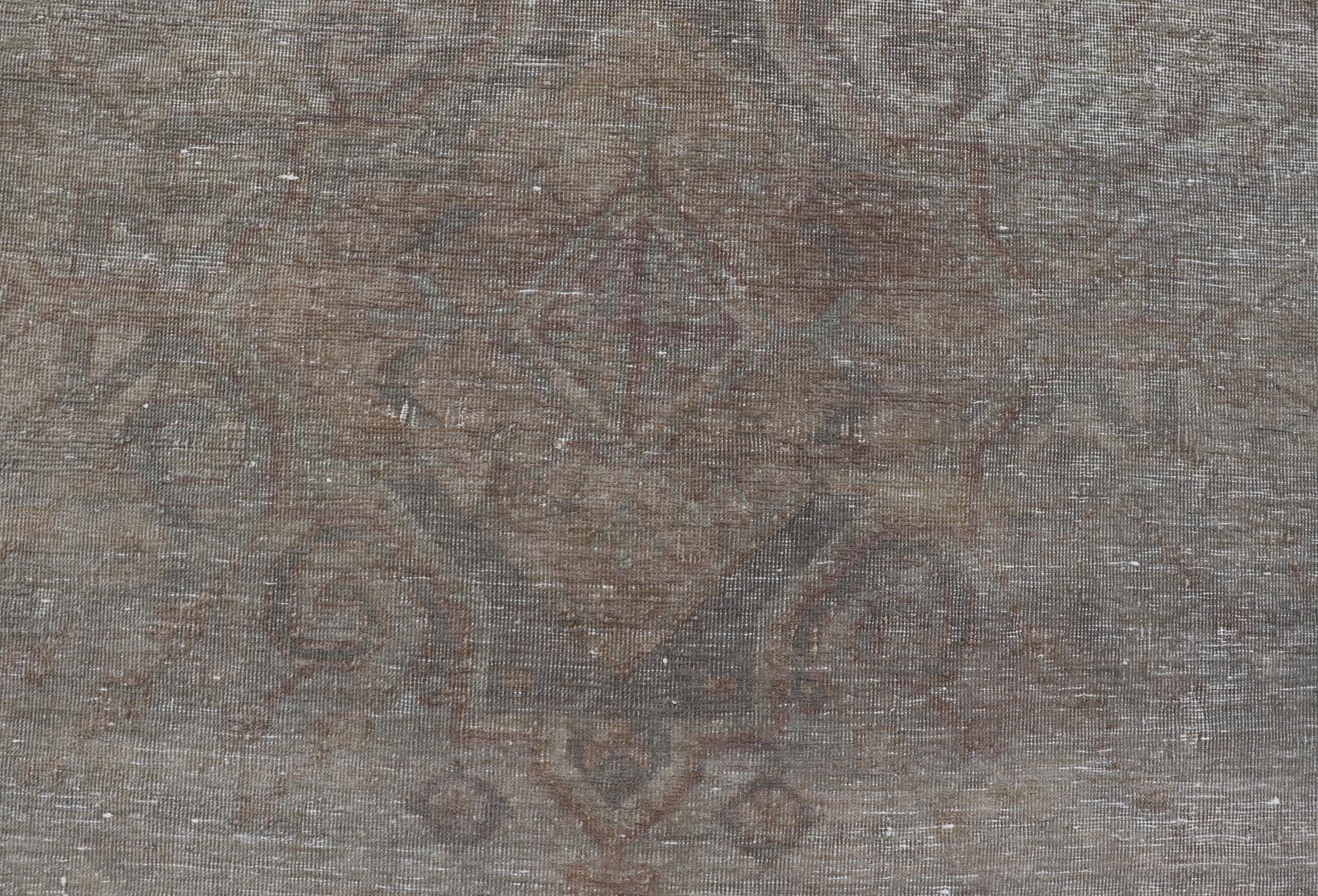 Antique Khotan Rug in Medallions with Silvery Background and Muted Colors. Keivan Woven Arts / rug EN - 179399, country of origin / type: Turkestan / Khotan, 1900 Measures: 8'0 x 10'6 This attractive Khotan rug is a spectacular testament to the co... - Keivan Woven ArtsEN - 179399 - 23696Rug
