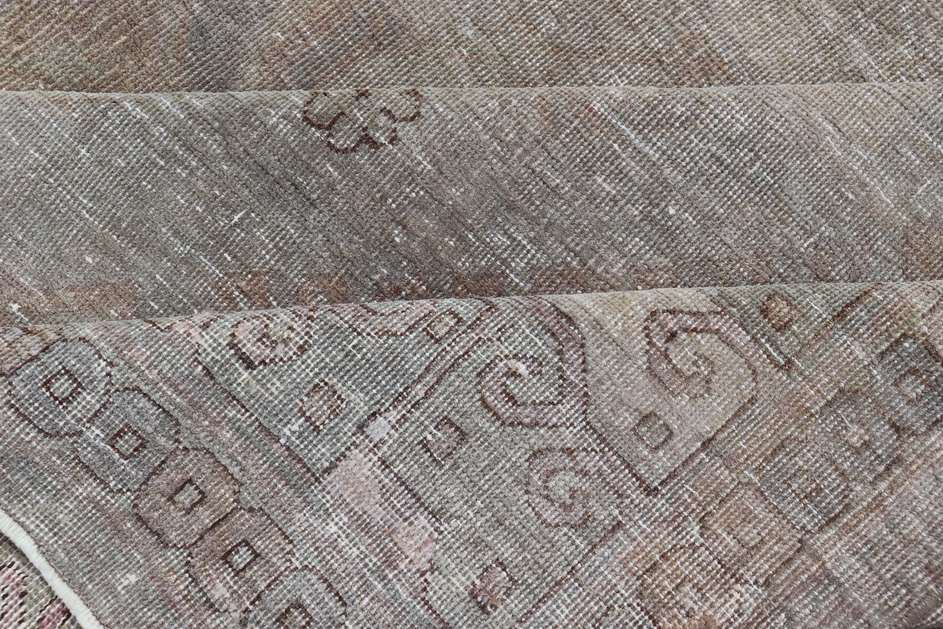 Antique Khotan Rug in Medallions with Silvery Background and Muted Colors. Keivan Woven Arts / rug EN - 179399, country of origin / type: Turkestan / Khotan, 1900 Measures: 8'0 x 10'6 This attractive Khotan rug is a spectacular testament to the co... - Keivan Woven ArtsEN - 179399 - 23696Rug
