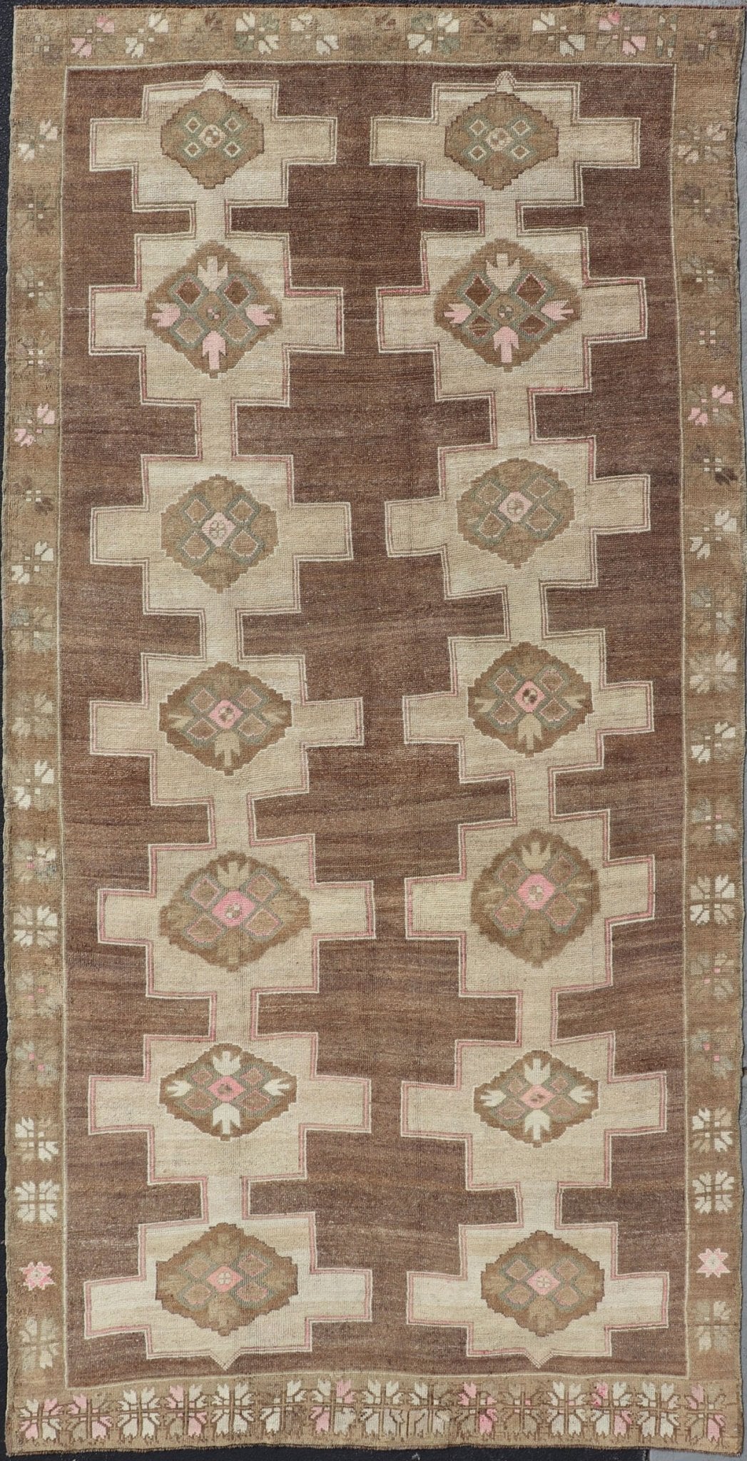 Vintage Kars Wide Gallery Rug in Brown Colors, Tan, Taupe and Light Green. Stacked in two rows of geometric medallions, this Vintage Turkish Kars wide gallery runner displays great geometry in chocolate Brown background with Colors such as Tan,... - Keivan Woven ArtsEN - 179569 - 14374Rug