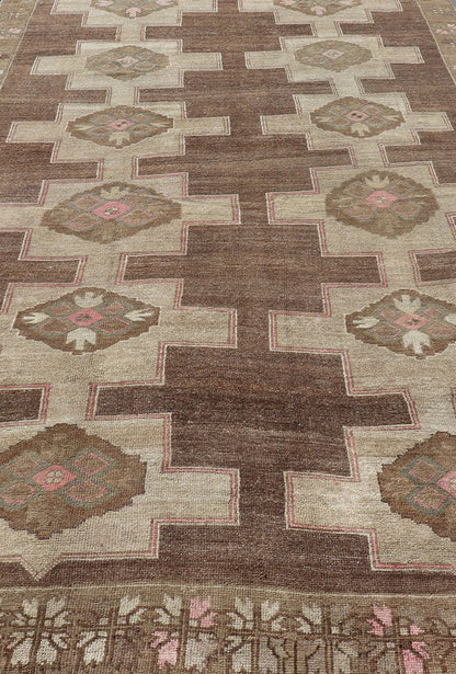 Vintage Kars Wide Gallery Rug in Brown Colors, Tan, Taupe and Light Green. Stacked in two rows of geometric medallions, this Vintage Turkish Kars wide gallery runner displays great geometry in chocolate Brown background with Colors such as Tan,... - Keivan Woven ArtsEN - 179569 - 14374Rug