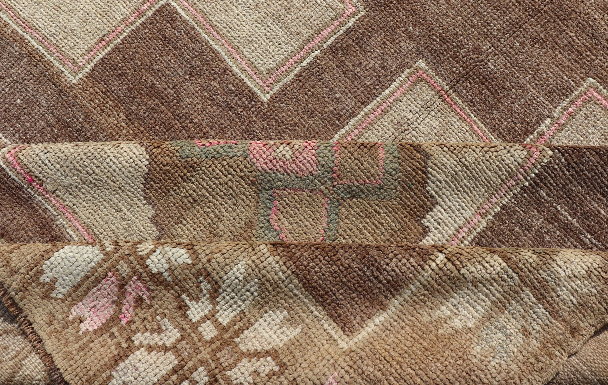 Vintage Kars Wide Gallery Rug in Brown Colors, Tan, Taupe and Light Green. Stacked in two rows of geometric medallions, this Vintage Turkish Kars wide gallery runner displays great geometry in chocolate Brown background with Colors such as Tan,... - Keivan Woven ArtsEN - 179569 - 14374Rug