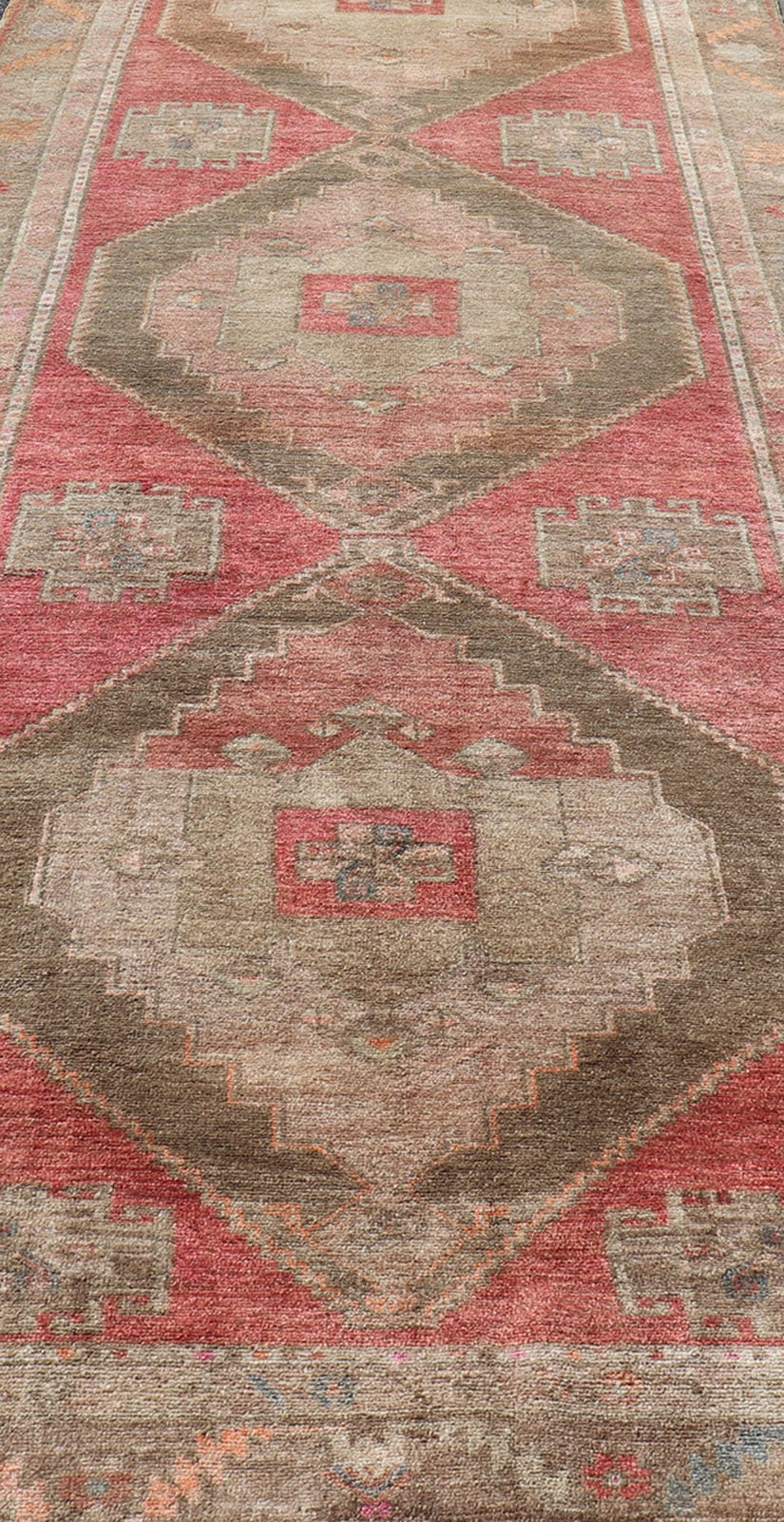 Long Gallery Turkish Vintage Runner with Medallion Design in Green, Pink. Vintage wide and long gallery runner from Turkey with geometric Medallion design in various tones of pink, coral, tan and variety of beautiful green colors, rug EN - 179586... - Keivan Woven ArtsEN - 179586 - 14378Rug