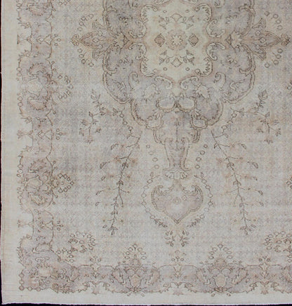 Keivan Woven Arts Vintage Turkish Distressed Rug in Sand, Cream, lavender, Taupe with brown highlights Measures:6'7 x 10'5 Sand, Taupe, cream and light lavender distressed vintage rug from Turkey with medallion design of etched motifs, ... - Keivan Woven ArtsEN - 179640 - 12627Rug