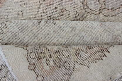 Keivan Woven Arts Vintage Turkish Distressed Rug in Sand, Cream, lavender, Taupe with brown highlights Measures:6'7 x 10'5 Sand, Taupe, cream and light lavender distressed vintage rug from Turkey with medallion design of etched motifs, ... - Keivan Woven ArtsEN - 179640 - 12627Rug
