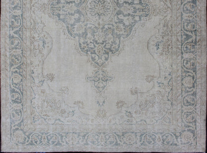 Medallion Distressed Oushak Turkey in Cream and Stone Blue Taupe, cream and blue Oushak rug vintage from Turkey with medallion design of etched motifs, rug EN - 179688, country of origin / type: Turkey / Oushak, circa 1950. This striking v... - Keivan Woven ArtsEN - 179688 - 12791Rug