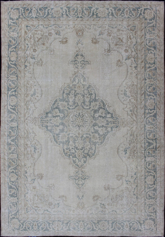 Medallion Distressed Oushak Turkey in Cream and Stone Blue Taupe, cream and blue Oushak rug vintage from Turkey with medallion design of etched motifs, rug EN - 179688, country of origin / type: Turkey / Oushak, circa 1950. This striking v... - Keivan Woven ArtsEN - 179688 - 12791