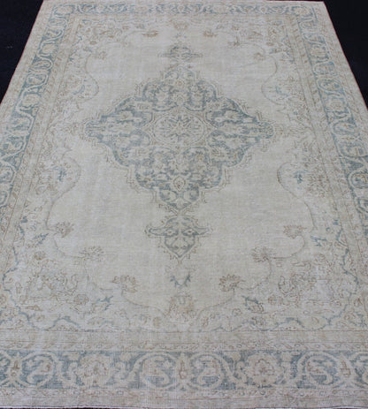 Medallion Distressed Oushak Turkey in Cream and Stone Blue Taupe, cream and blue Oushak rug vintage from Turkey with medallion design of etched motifs, rug EN - 179688, country of origin / type: Turkey / Oushak, circa 1950. This striking v... - Keivan Woven ArtsEN - 179688 - 12791Rug