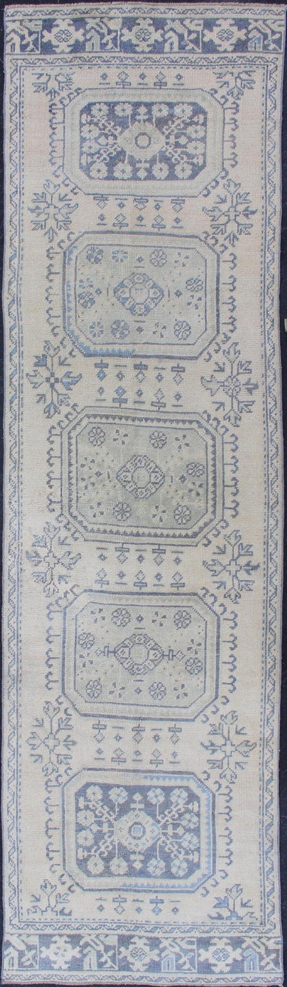 Vintage Turkish Oushak Runner in Faded Blue in Neutral Background Oushak vintage rug from Turkey with medallion design, rug EN - 179700, country of origin / type: Turkey / Oushak, circa 1940. This vintage Turkish Oushak rug features a multi... - Keivan Woven ArtsEN - 179700 - 12553Rug