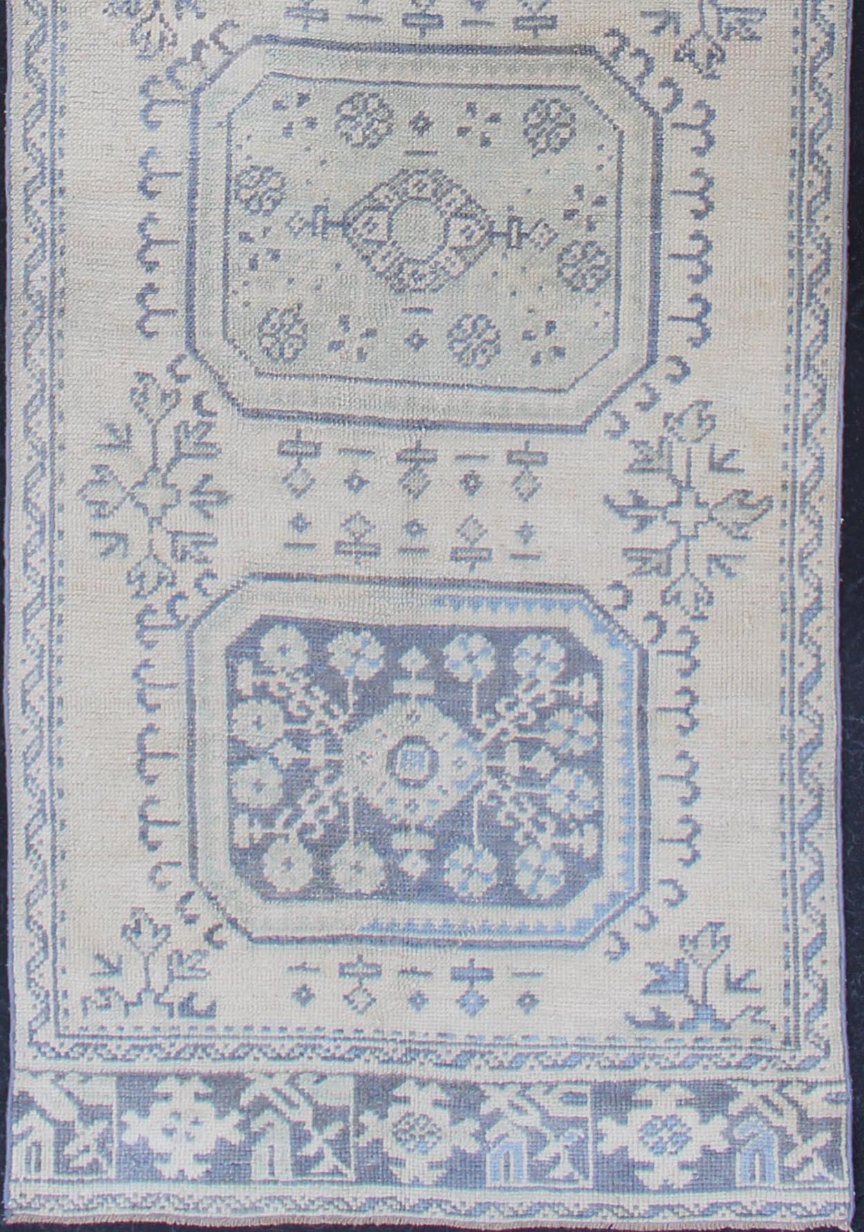 Vintage Turkish Oushak Runner in Faded Blue in Neutral Background Oushak vintage rug from Turkey with medallion design, rug EN - 179700, country of origin / type: Turkey / Oushak, circa 1940. This vintage Turkish Oushak rug features a multi... - Keivan Woven ArtsEN - 179700 - 12553Rug
