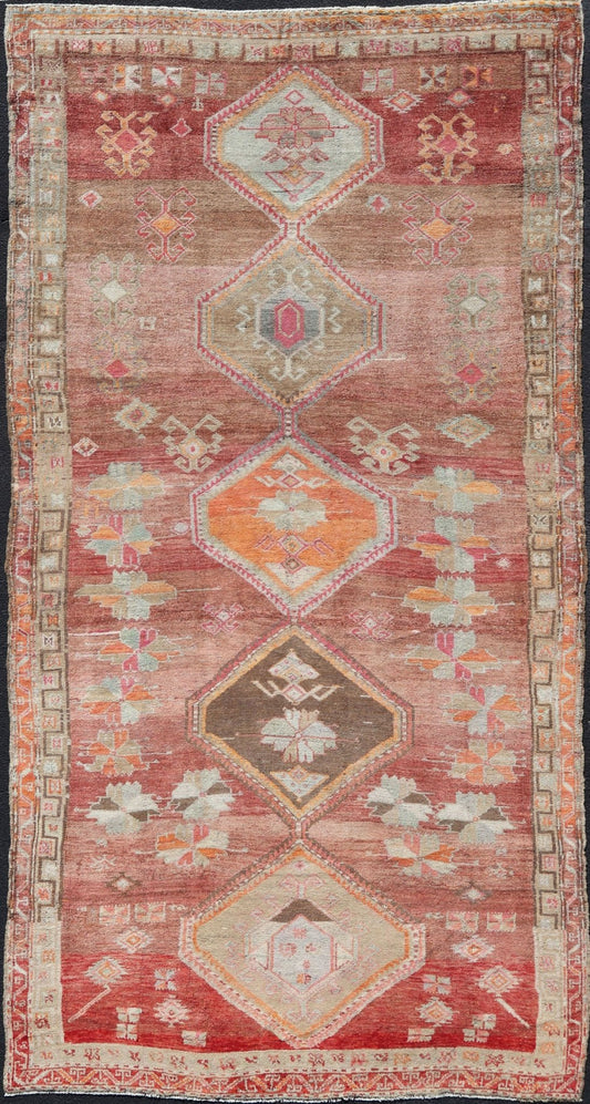 Long Rug, Vintage Turkish Gallery Rug with Tribal Design in Variegated Red. Turkish tribal design colorful gallery runner in soft red and multi colors, rug EN - 179883, country of origin / type: Turkey / Oushak, circa 1930 This expansive G... - Keivan Woven ArtsEN - 179883 - 14254Rug