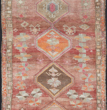 Long Rug, Vintage Turkish Gallery Rug with Tribal Design in Variegated Red. Turkish tribal design colorful gallery runner in soft red and multi colors, rug EN - 179883, country of origin / type: Turkey / Oushak, circa 1930 This expansive G... - Keivan Woven ArtsEN - 179883 - 14254Rug