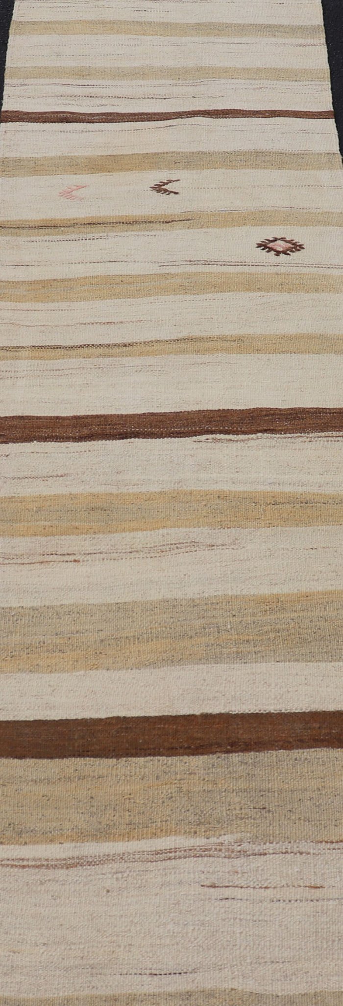 Minimalist design with traces of stripes Kilim runner in cream, light brown and taupe, Keivan Woven Arts / rug EN - 179919, country of origin / type: Turkey / Kilim, circa 1950 This flat - woven Kilim runner from Turkey features an understated compo... - Keivan Woven ArtsEN - 179919 - 17796Rug