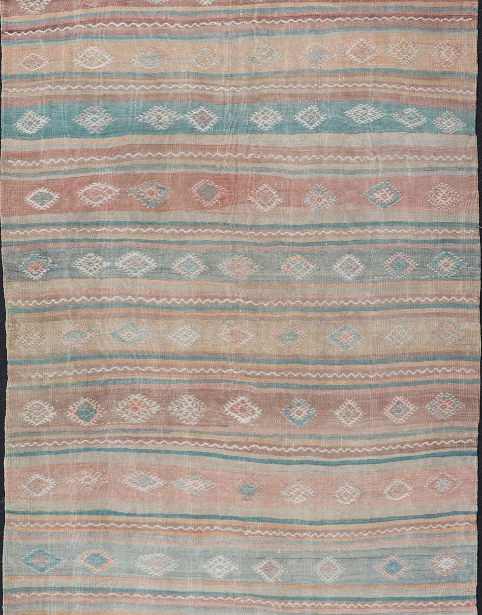Vintage Turkish Gallery Kilim runner with Stripes and Tribal Motifs in Muted colorful Tones. Keivan Woven Arts / rug EN - 179946, country of origin / type: Turkey / Kilim, circa Mid - 20th Century. Measures: 5'4 x 11'9 Woven during the mid - ... - Keivan Woven ArtsEN - 179946 - 15424Rug