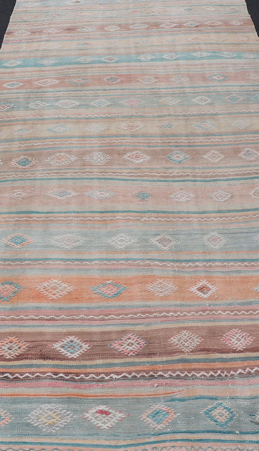 Vintage Turkish Gallery Kilim runner with Stripes and Tribal Motifs in Muted colorful Tones. Keivan Woven Arts / rug EN - 179946, country of origin / type: Turkey / Kilim, circa Mid - 20th Century. Measures: 5'4 x 11'9 Woven during the mid - ... - Keivan Woven ArtsEN - 179946 - 15424Rug