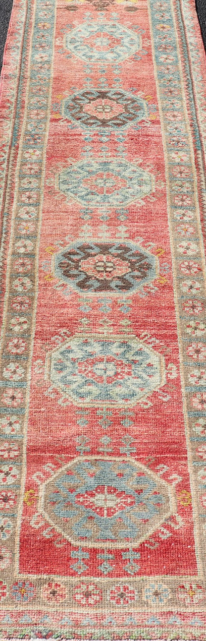 Vintage Hand Knotted Oushak Turkish Runner with Geometric Medallion Design Vintage Oushak runner from Turkey with Medallion design in various blue, soft red, brown, yellow and tan tones, Keivan Woven Arts / rug EN - 179957, country of origin / typ... - Keivan Woven ArtsEN - 179957 - 17682Rug