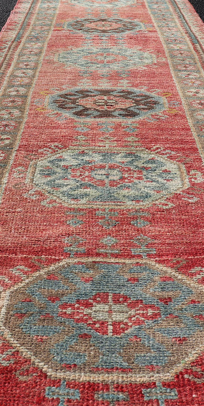 Vintage Hand Knotted Oushak Turkish Runner with Geometric Medallion Design Vintage Oushak runner from Turkey with Medallion design in various blue, soft red, brown, yellow and tan tones, Keivan Woven Arts / rug EN - 179957, country of origin / typ... - Keivan Woven ArtsEN - 179957 - 17682Rug