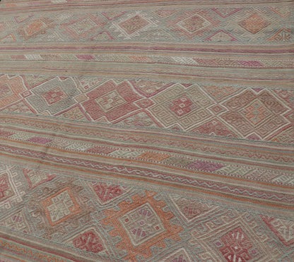 Colorful Vintage Embroidered Kilim with Stripes and Alternating Geometric Motifs. Keivan Woven Arts / rug EN - 2016, country of origin / type: Turkey / Kilim, circa 1950 Measures: 6'9 x 9'3 This vintage Kilim displays an array of designs, includin... - Keivan Woven ArtsEN - 2016 - 15314Rug