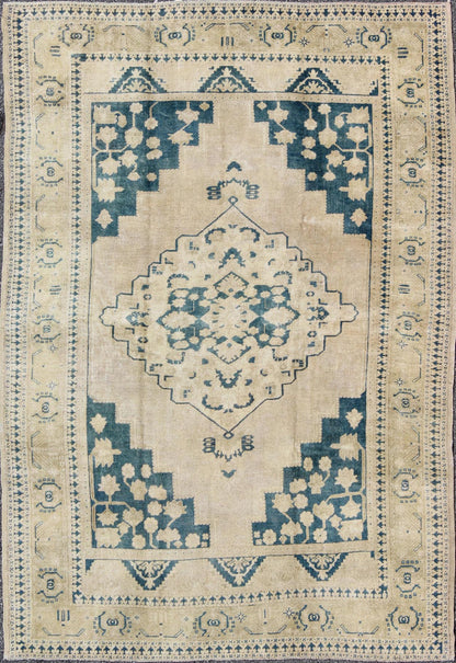 Turkish Oushak Rug This geometric Turkish Oushak carpet rests beautifully upon an ivory background with a cream border. A blue outlined medallion takes center stage and is well balanced by four organic corner motifs composed of the same blue and... - Keivan Woven ArtsEN - 240 - 3064Rug