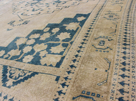 Turkish Oushak Rug This geometric Turkish Oushak carpet rests beautifully upon an ivory background with a cream border. A blue outlined medallion takes center stage and is well balanced by four organic corner motifs composed of the same blue and... - Keivan Woven ArtsEN - 240 - 3064