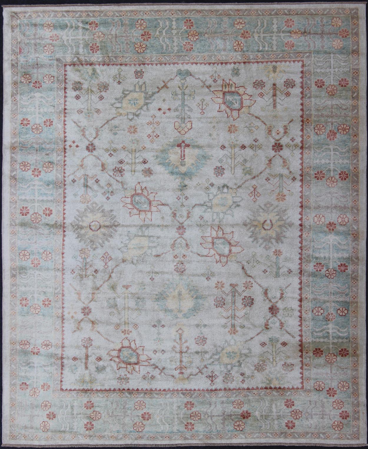 Antique Reproduction Turkish Oushak. Measures: 9'4 x 11'4. This sub geometric Oushak rug from Turkey features subdued colors in blue, light green, rust and, neutral color palette and an all - over design of floral shapes, surrounded beautifully by ... - Keivan Woven ArtsEN - 3264 - 5452Rug