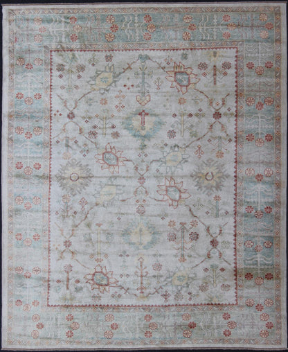 Antique Reproduction Turkish Oushak. Measures: 9'4 x 11'4. This sub geometric Oushak rug from Turkey features subdued colors in blue, light green, rust and, neutral color palette and an all - over design of floral shapes, surrounded beautifully by ... - Keivan Woven ArtsEN - 3264 - 5452Rug
