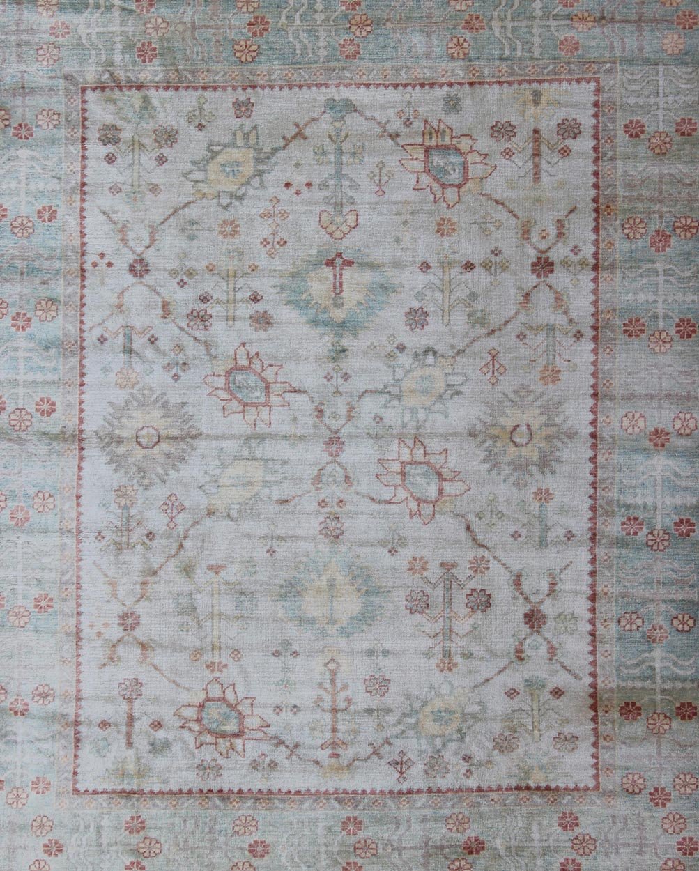 Antique Reproduction Turkish Oushak. Measures: 9'4 x 11'4. This sub geometric Oushak rug from Turkey features subdued colors in blue, light green, rust and, neutral color palette and an all - over design of floral shapes, surrounded beautifully by ... - Keivan Woven ArtsEN - 3264 - 5452Rug