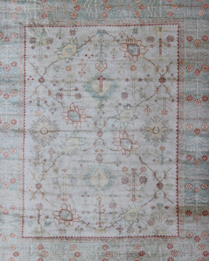 Antique Reproduction Turkish Oushak. Measures: 9'4 x 11'4. This sub geometric Oushak rug from Turkey features subdued colors in blue, light green, rust and, neutral color palette and an all - over design of floral shapes, surrounded beautifully by ... - Keivan Woven ArtsEN - 3264 - 5452Rug