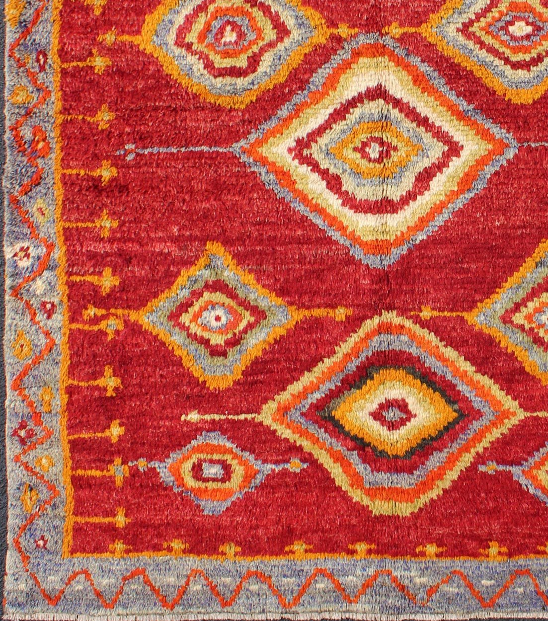 Tribal Turkish Konya Rug With Diamond Design in Beautiful Royal Red Background This brilliant Tribal Konya rug showcases a multi - layered diamond pattern with a range of green, orange, yellow and blue that glow in the bright red field. A light gr... - Keivan Woven ArtsEN - 3270 - 5456Rug