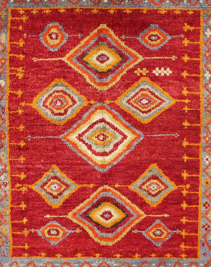 Tribal Turkish Konya Rug With Diamond Design in Beautiful Royal Red Background This brilliant Tribal Konya rug showcases a multi - layered diamond pattern with a range of green, orange, yellow and blue that glow in the bright red field. A light gr... - Keivan Woven ArtsEN - 3270 - 5456Rug