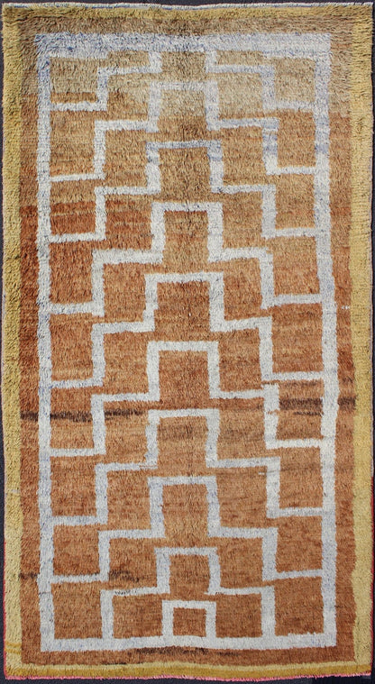 This vintage Tulu from mid - 20th century Turkey boasts an interconnected tribal pattern. The multi - tiered pattern consists of ivory outlines set on a light orange field. The contrast of color adds a particular depth to accentuate the unique style of thi... - Keivan Woven ArtsEN - 3313 - 5514Rug