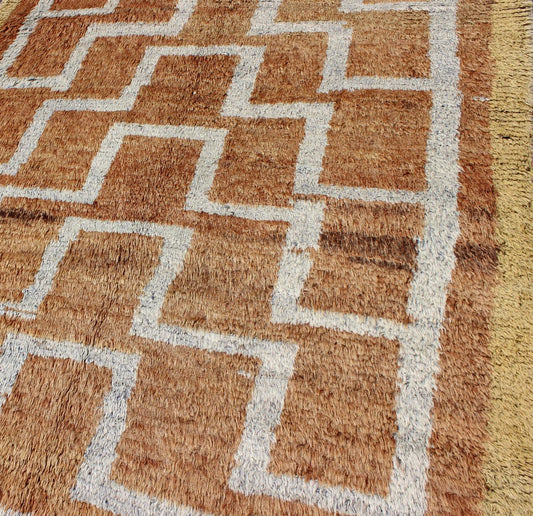 This vintage Tulu from mid - 20th century Turkey boasts an interconnected tribal pattern. The multi - tiered pattern consists of ivory outlines set on a light orange field. The contrast of color adds a particular depth to accentuate the unique style of thi... - Keivan Woven ArtsEN - 3313 - 5514Rug