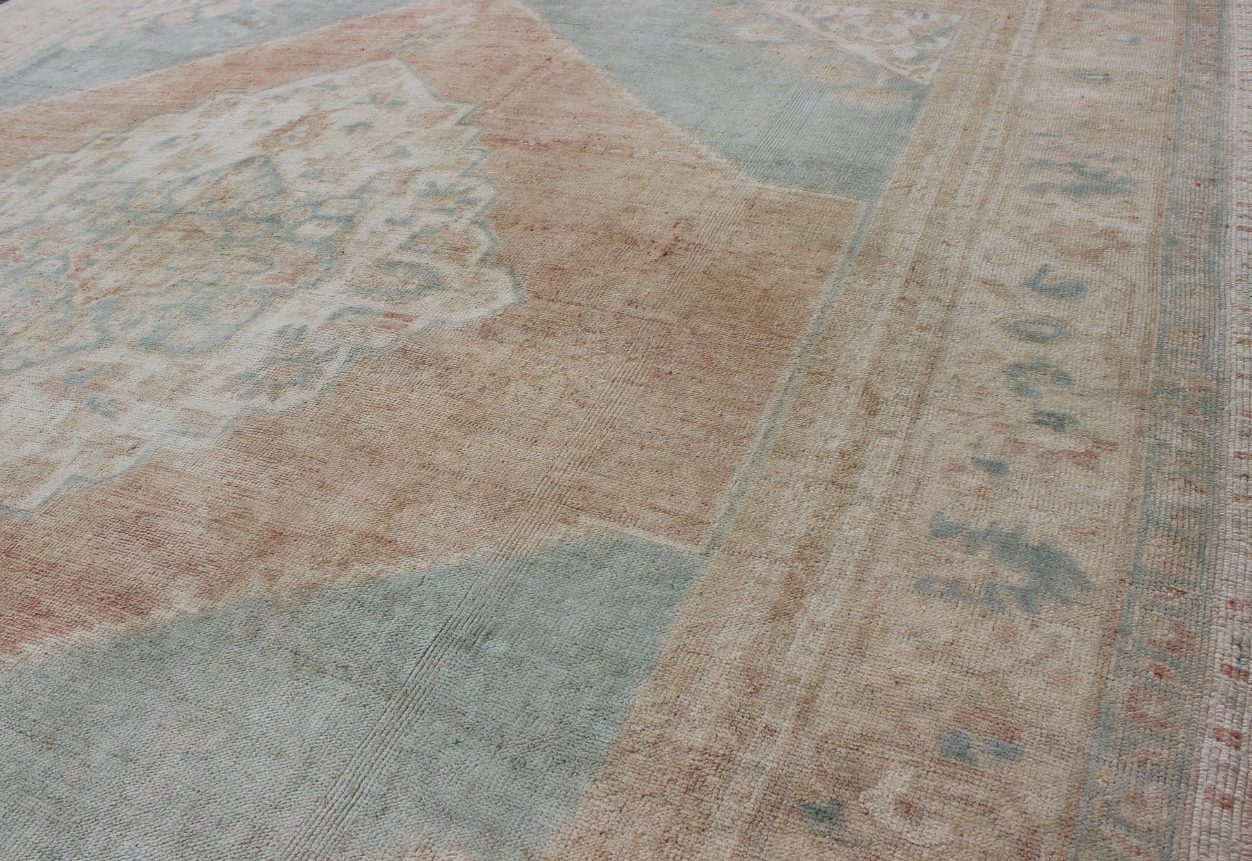 Light blue, topaz, faded grey and rust vintage Turkish Oushak rug in squared shape with layered Medallion, rug en - 4093, country of origin / type: Turkey / Oushak, circa 1930 This striking vintage Turkish Oushak rug bears a faded grey - colored bod... - Keivan Woven ArtsEN - 4093 - 1616Rug