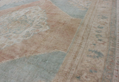 Light blue, topaz, faded grey and rust vintage Turkish Oushak rug in squared shape with layered Medallion, rug en - 4093, country of origin / type: Turkey / Oushak, circa 1930 This striking vintage Turkish Oushak rug bears a faded grey - colored bod... - Keivan Woven ArtsEN - 4093 - 1616Rug