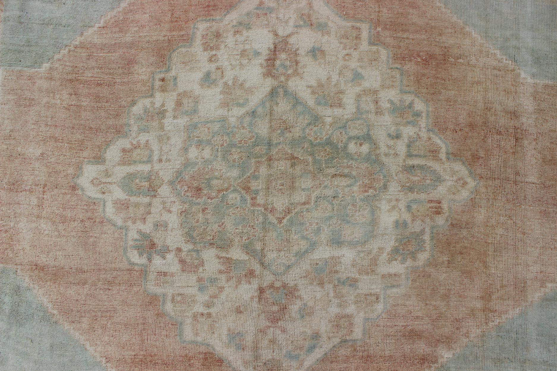 Light blue, topaz, faded grey and rust vintage Turkish Oushak rug in squared shape with layered Medallion, rug en - 4093, country of origin / type: Turkey / Oushak, circa 1930 This striking vintage Turkish Oushak rug bears a faded grey - colored bod... - Keivan Woven ArtsEN - 4093 - 1616Rug