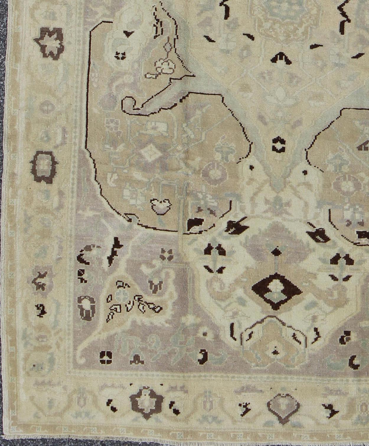 Earthy Vintage Turkish Oushak Carpet with Multi - Medallions and Neutral Colors Vintage Turkish Oushak Carpet in Neutral Colors rug/en - 4365 origin/turkey kwarugs Produced in mid - 20th century Turkey, this earthy vintage Oushak is characte... - Keivan Woven ArtsEN - 4365 - 1622Rug