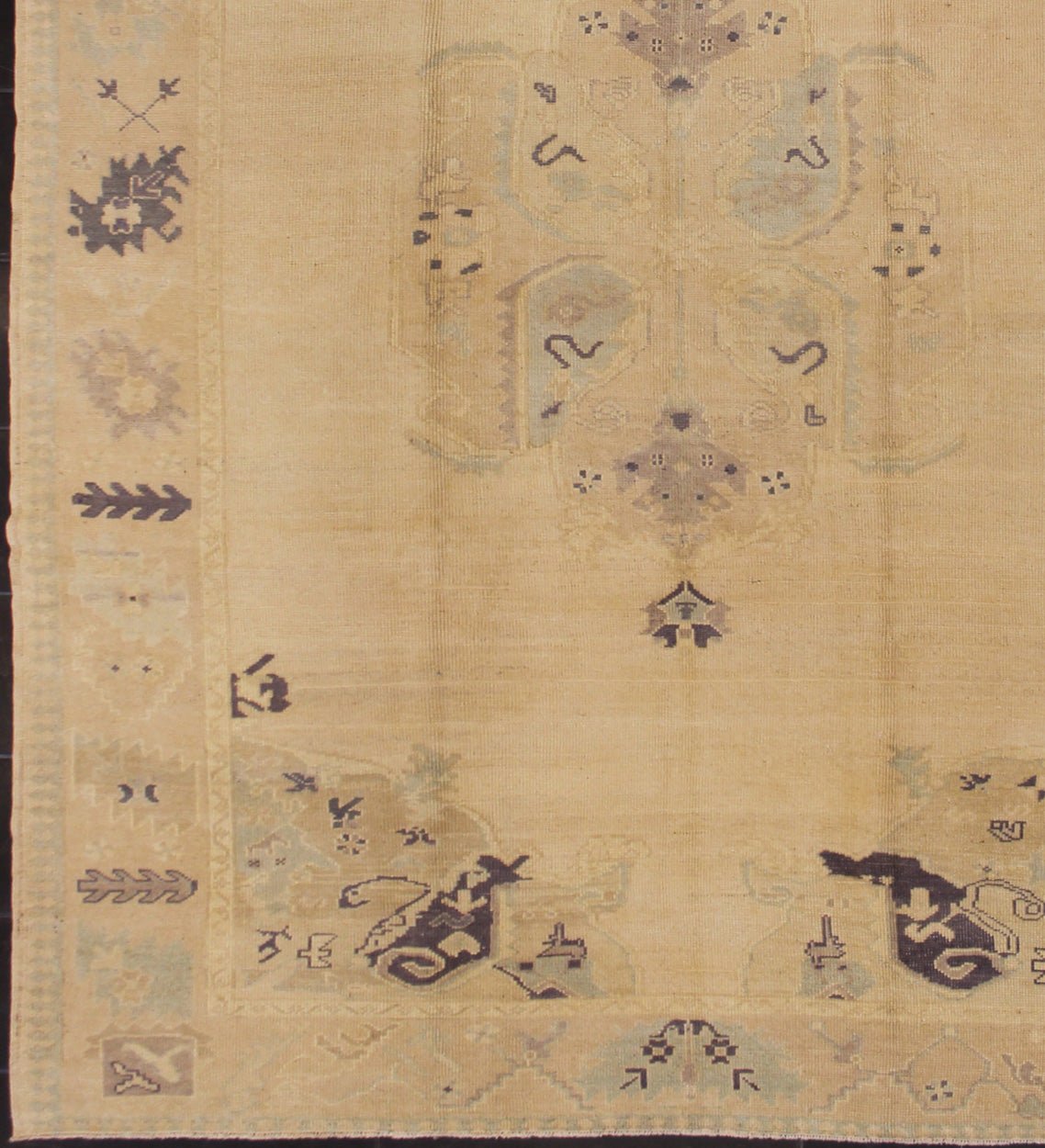Muted Turkish Oushak Rug with Light Gray Field and Blue Accents This muted Oushak carpet rests beautifully upon a field of elegant light buttery color. A large medallion takes center stage and is well balanced by four prominent organic corner mo... - Keivan Woven ArtsEN - 4375 - 4892Rug