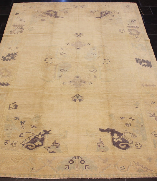 Muted Turkish Oushak Rug with Light Gray Field and Blue Accents This muted Oushak carpet rests beautifully upon a field of elegant light buttery color. A large medallion takes center stage and is well balanced by four prominent organic corner mo... - Keivan Woven ArtsEN - 4375 - 4892