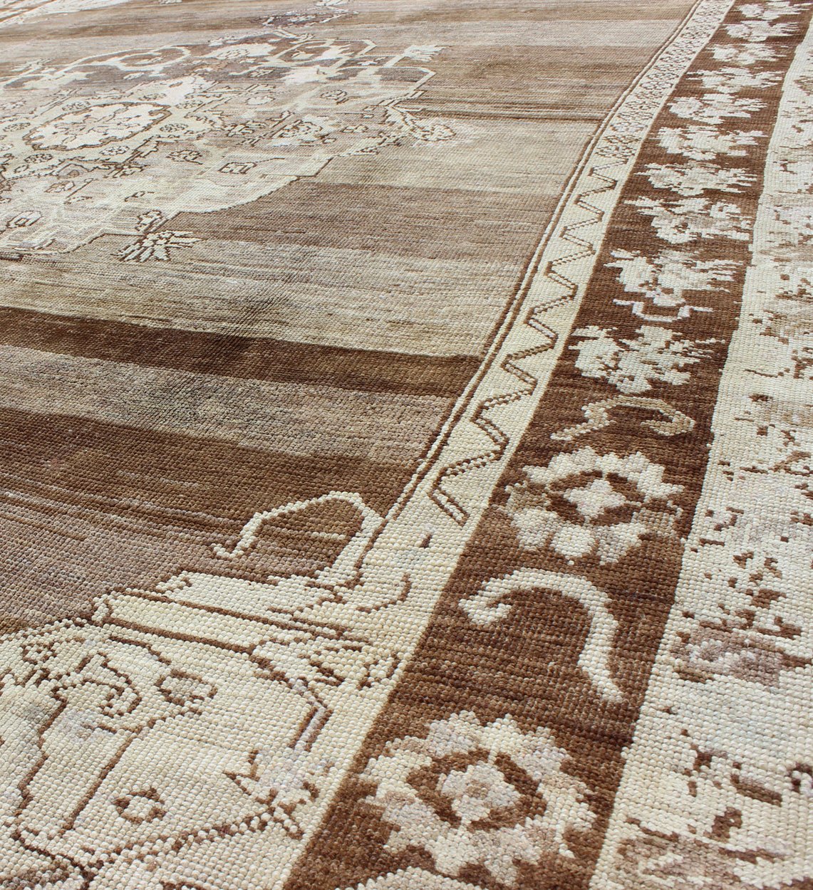 Unique Turkish Kars Carpet in Brown, Gray,and Ivory This striking and unique carpet combines a traditional center field with an Art Deco border and features a color palette including brown, cream, and ivory. Measures: 8'0 x 12'5. - Keivan Woven ArtsEN - 4607 - 1636Rug