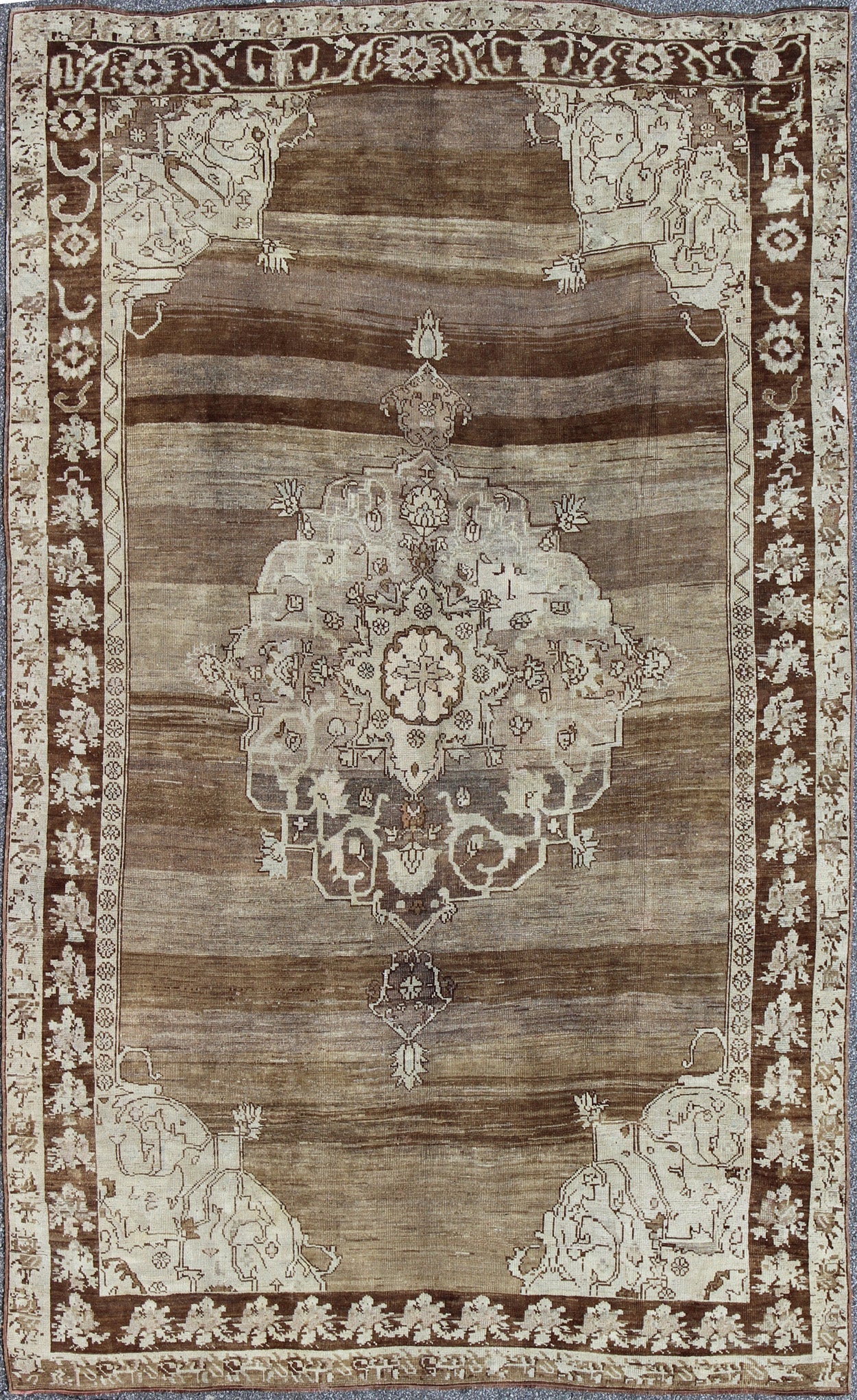 Unique Turkish Kars Carpet in Brown, Gray,and Ivory This striking and unique carpet combines a traditional center field with an Art Deco border and features a color palette including brown, cream, and ivory. Measures: 8'0 x 12'5. - Keivan Woven ArtsEN - 4607 - 1636Rug