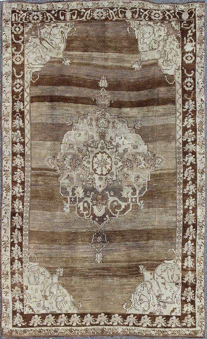 Unique Turkish Kars Carpet in Brown, Gray,and Ivory This striking and unique carpet combines a traditional center field with an Art Deco border and features a color palette including brown, cream, and ivory. Measures: 8'0 x 12'5. - Keivan Woven ArtsEN - 4607 - 1636Rug