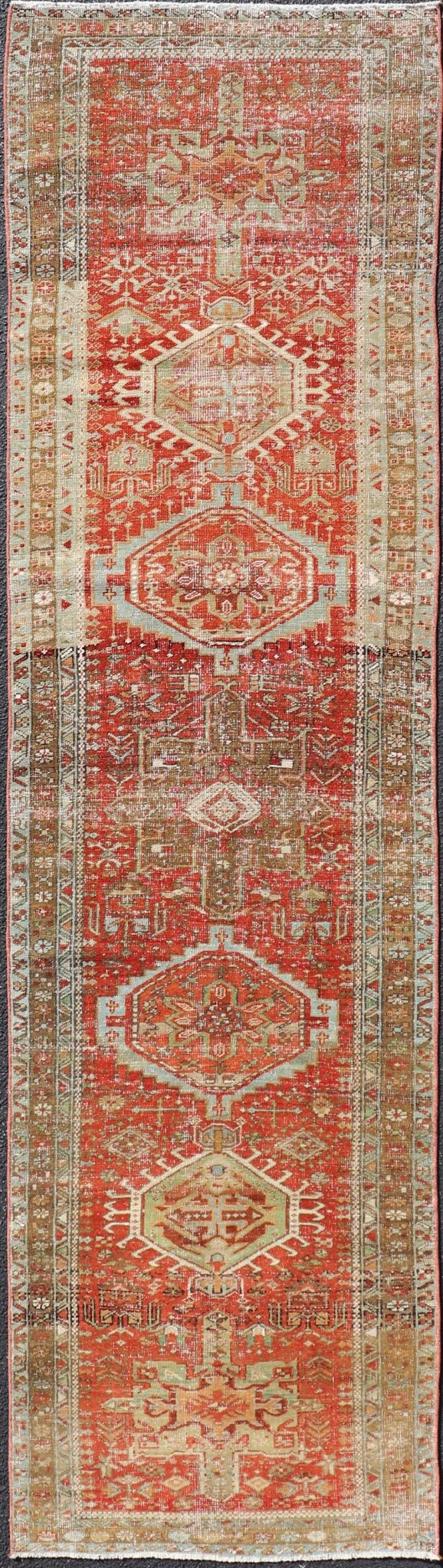 Measures: 2'8 x 10'6 Antique Persian Heriz Distressed Runner with Geometric Medallions in Soft Colors. rug EN - 4651, country of origin / type: Iran / Heriz, circa 1920 This antique Persian Heriz runner, from northwest Iran, displays a geometr... - Keivan Woven ArtsEN - 4651 - 19881Rug
