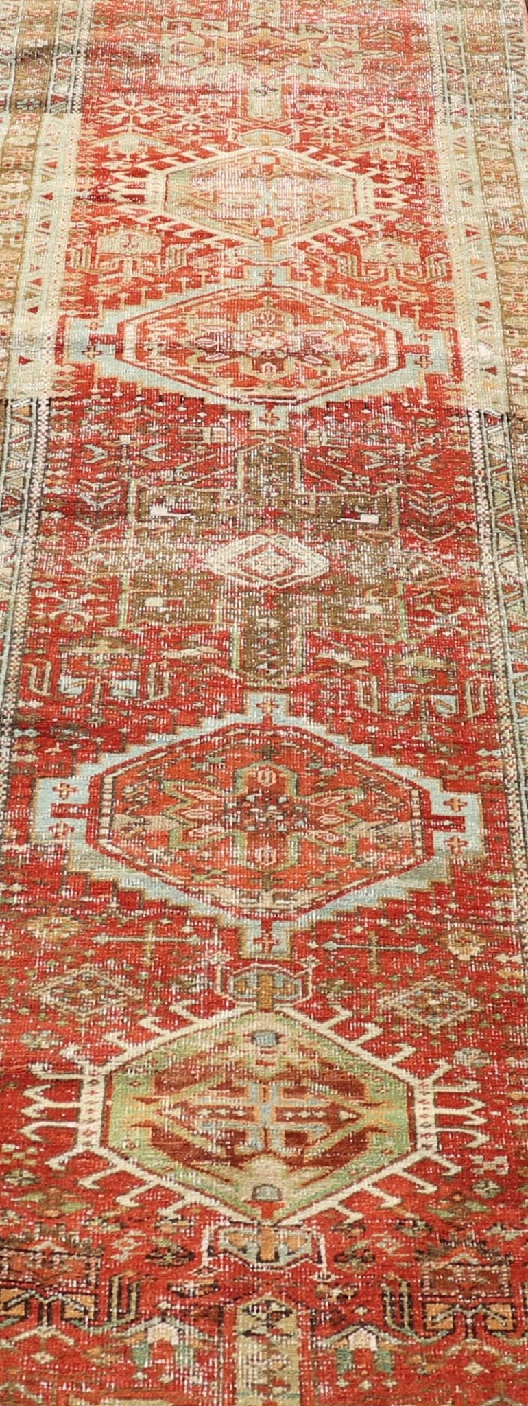 Measures: 2'8 x 10'6 Antique Persian Heriz Distressed Runner with Geometric Medallions in Soft Colors. rug EN - 4651, country of origin / type: Iran / Heriz, circa 1920 This antique Persian Heriz runner, from northwest Iran, displays a geometr... - Keivan Woven ArtsEN - 4651 - 19881Rug