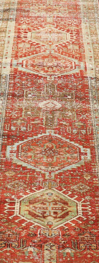 Measures: 2'8 x 10'6 Antique Persian Heriz Distressed Runner with Geometric Medallions in Soft Colors. rug EN - 4651, country of origin / type: Iran / Heriz, circa 1920 This antique Persian Heriz runner, from northwest Iran, displays a geometr... - Keivan Woven ArtsEN - 4651 - 19881Rug