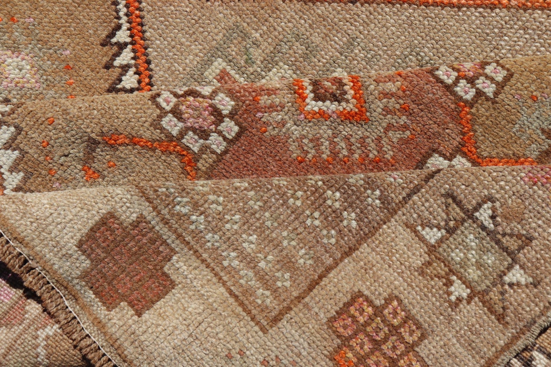 Vintage Turkish Kars Gallery Runner in Brown Color, Tan, Taupe and Orange. Keivan Woven Arts rug EN - 4655, country of origin / type: Turkey / Kars, circa 1950 Measures: 5'9 x 13'4 This vintage gallery runner features an assortment of tribal and g... - Keivan Woven ArtsEN - 4655 - 17436Rug