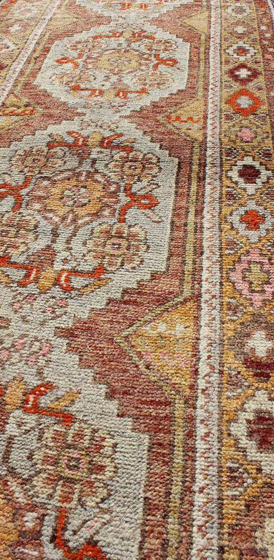 Colorful Antique Oushak Runner with Four Medallions in Yellow, Red, Green, Gray, rug en - 486, country of origin / type: turkey / Oushak, circa 1930s This beautiful antique Oushak runner from early 20th century turkey features a classic Oushak des... - Keivan Woven ArtsEN - 486 - 3407Rug