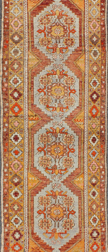 Colorful Antique Oushak Runner with Four Medallions in Yellow, Red, Green, Gray, rug en - 486, country of origin / type: turkey / Oushak, circa 1930s This beautiful antique Oushak runner from early 20th century turkey features a classic Oushak des... - Keivan Woven ArtsEN - 486 - 3407Rug