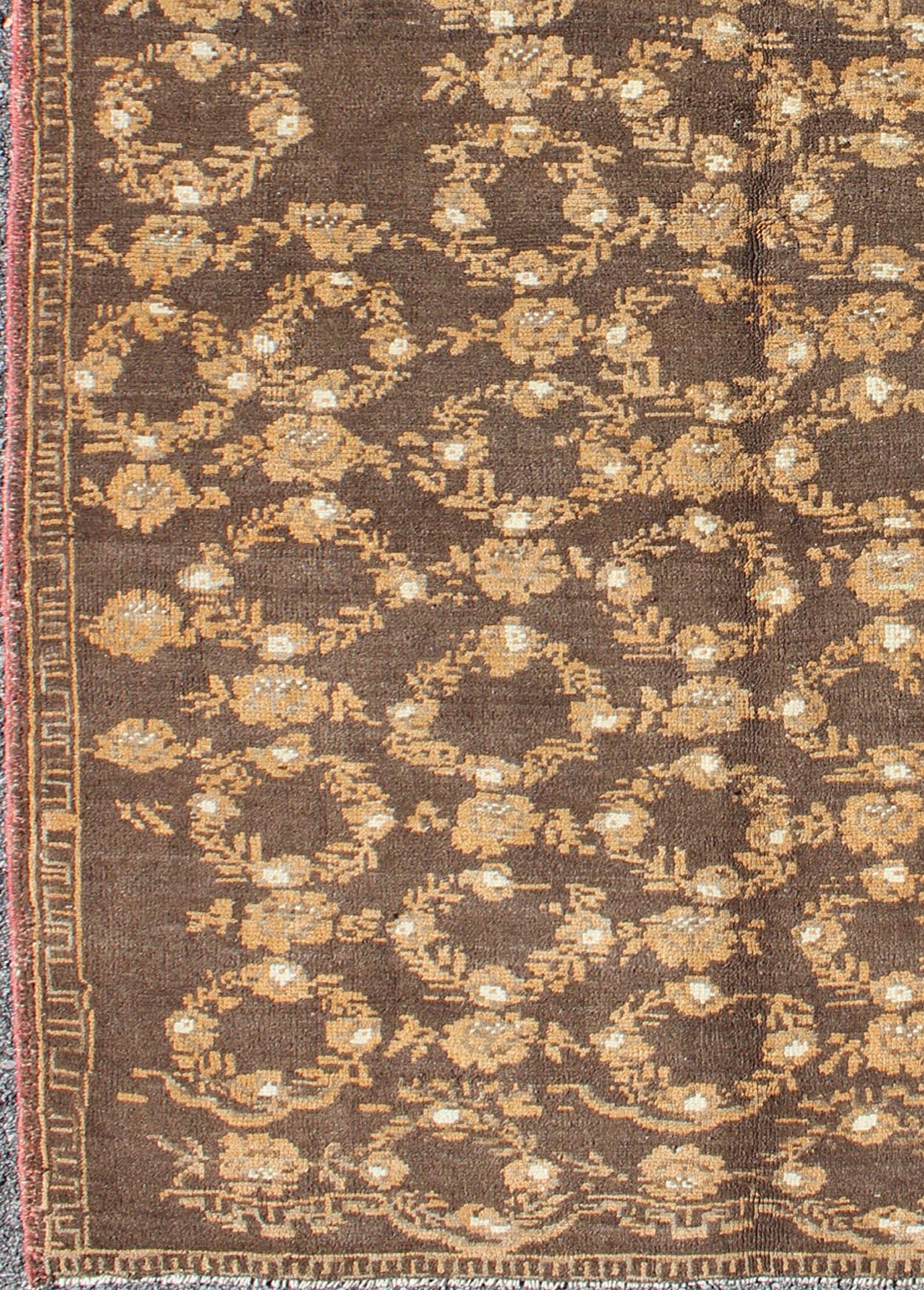 All - Over Floral Wreath Design Turkish Oushak Rug with Brown Background Measures: 4'5 x 7'4 The design of this beautiful vintage Oushak rug from mid - 20th century Turkey is enhanced by its rich colored wool. The brown ground is home to an a... - Keivan Woven ArtsEN - 534 - 3678Rug