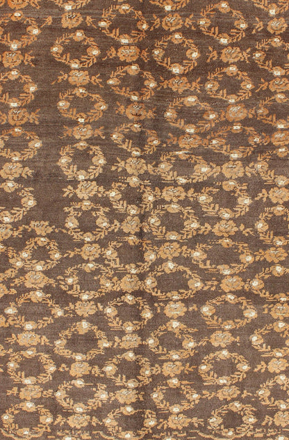 All - Over Floral Wreath Design Turkish Oushak Rug with Brown Background Measures: 4'5 x 7'4 The design of this beautiful vintage Oushak rug from mid - 20th century Turkey is enhanced by its rich colored wool. The brown ground is home to an a... - Keivan Woven ArtsEN - 534 - 3678Rug