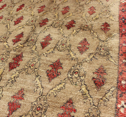 Mid Century Tulu Carpet in Sand color background. This mid century Tulu rug features repeating red motifs laid across a sand - colored field and enclosed within similarly - colored frames. Tulu rugs were woven in Konya area, in central Anato... - Keivan Woven ArtsEN - 623 - 4842Rug